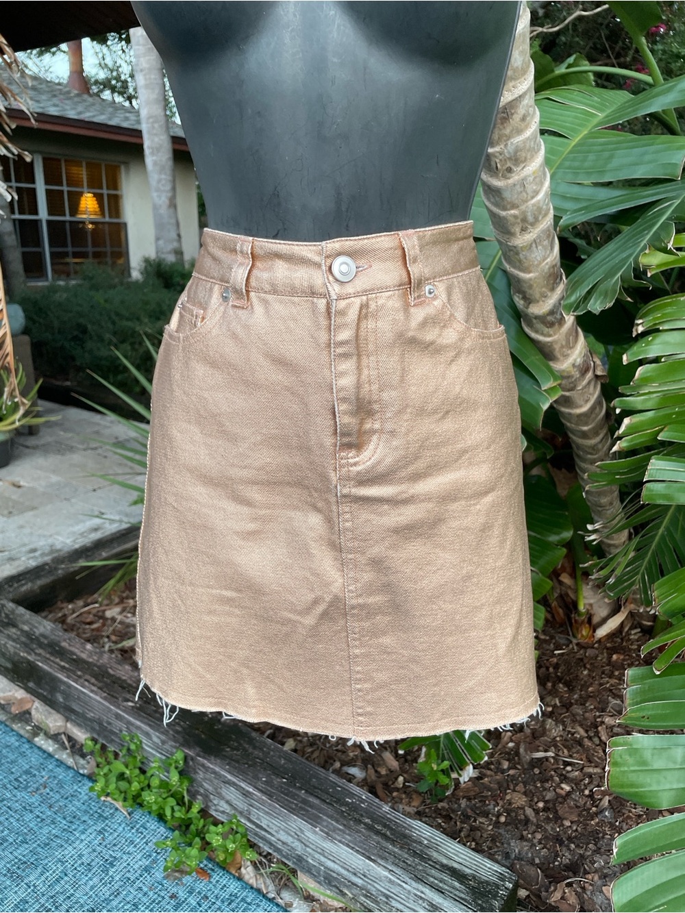 Rose gold denim mini skirt I want and need.
